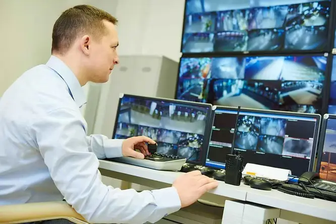 Home Monitoring Systems a Man Watching on the Screen
