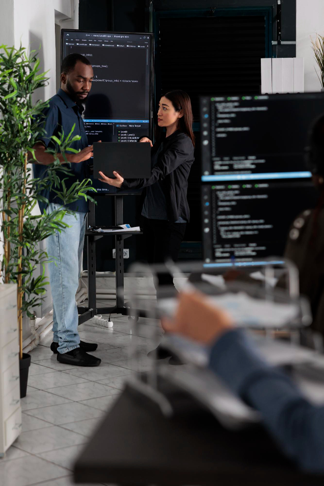 Vizdomtech team collaborating in office